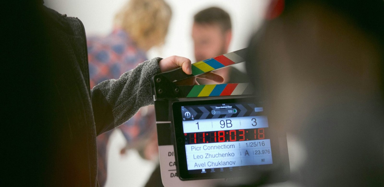 person holding clapperboard