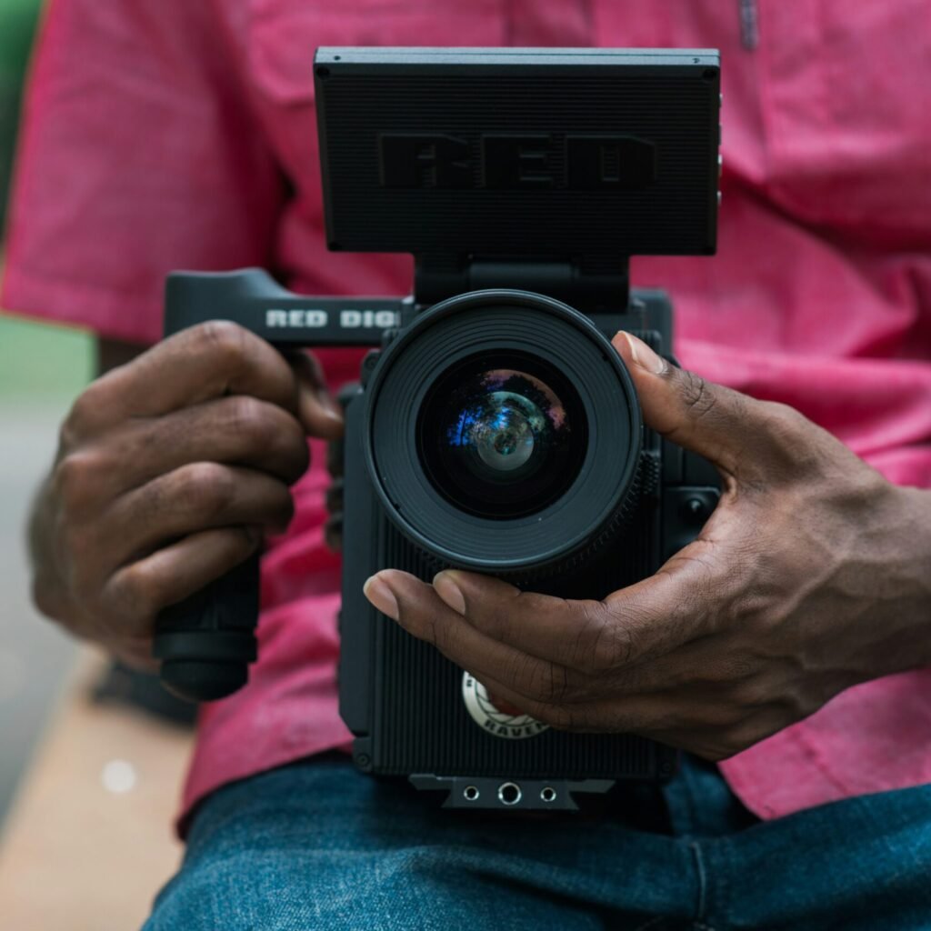 person holding black DSLR camera